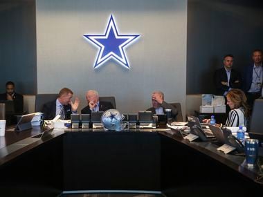 Dallas Cowboys Head Coach Jason Garrett, left, Owner Jerry Jones, and Chief Operating Officer Stephen Jones head the table in The War Room during the first round of the NFL Draft on Thursday, April 25, 2019 at The Star in Frisco, Texas.