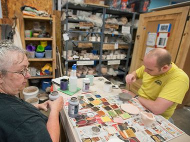 Beth Appleton and Chris Tsongas worked on ceramics projects at the Dallas Makerspace during an open house on June 1 in Carrollton. The Irving Public Library plans to open two makerspaces this spring.