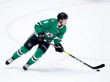 Dallas Stars defenseman Miro Heiskanen (4) turns the puck up ice against the Carolina Hurricanes during the first period at the American Airlines Center in Dallas, Tuesday, April 27, 2021.