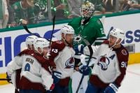 Dallas Stars goaltender Jake Oettinger (29) looks away as Colorado Avalanche right wing...