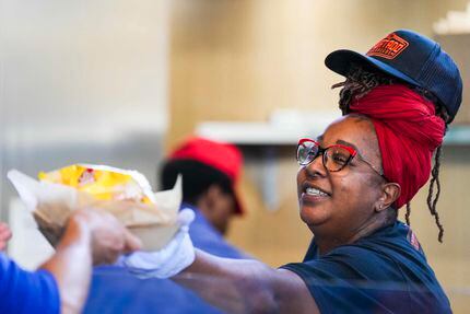 Loretta Ransaw, a volunteer for New Generation Church, delivered a brisket sandwich basket...