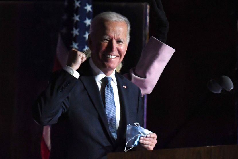 Democratic presidential nominee Joe Biden gestures as he arrives onstage to address...