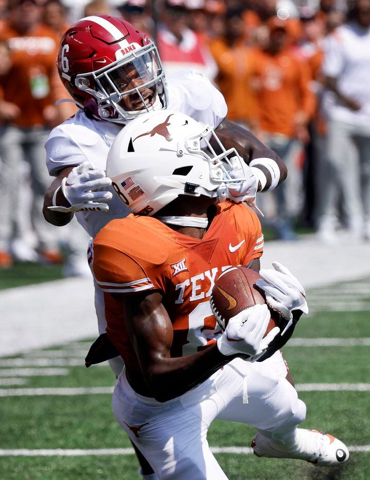 Texas Longhorns wide receiver Xavier Worthy (8) pulls in a long pass and nearly scores as...