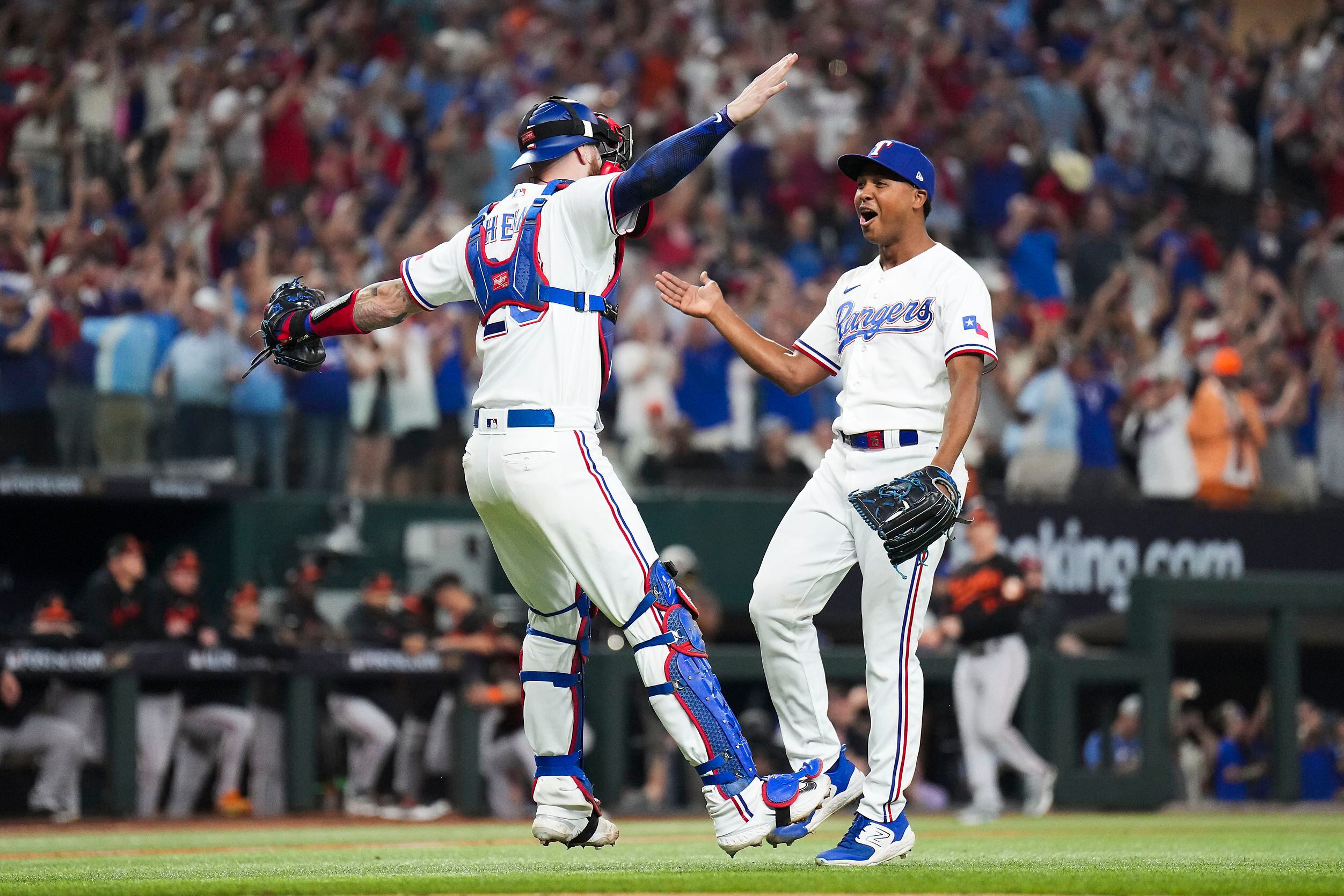 Texas Rangers relief pitcher Jose Leclerc is congratulated by catcher Jonah  Heim after the Rangers