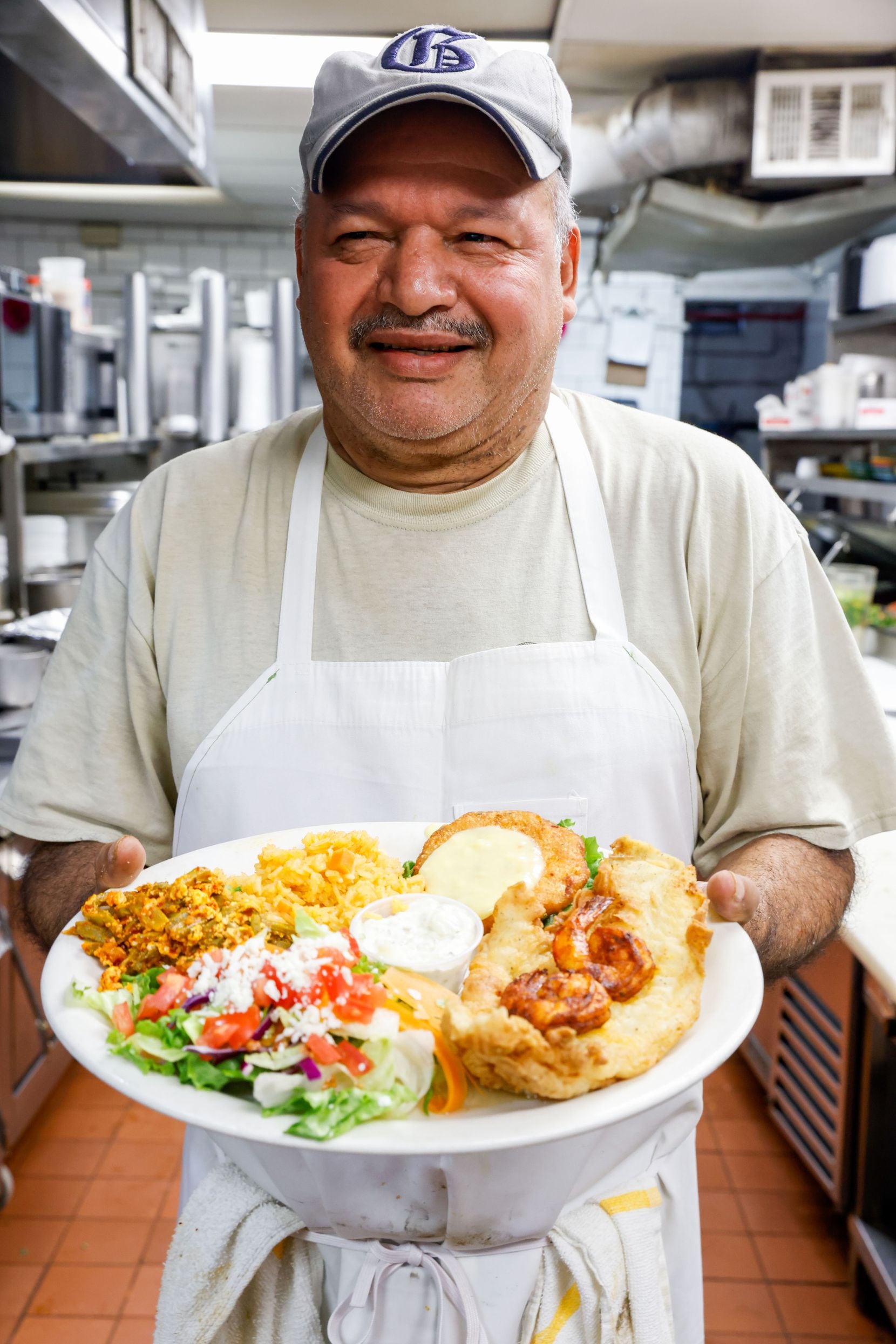 Alejandrino Fernández, 66, poses for a portrait with a Mexican Lent dish at El Ranchito in...