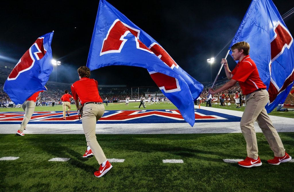 Southern Methodist Mustangs flags are flown after a touchdown during a matchup between the...