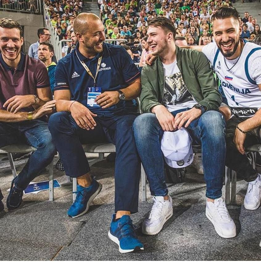Marko Milic and Luka Doncic laugh during an event with the Slovenia national team. (Photo...