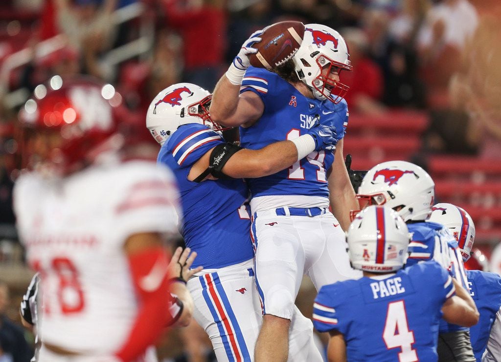 Southern Methodist Mustangs tight end Ryan Becker (14) celebrates a touchdown during a...