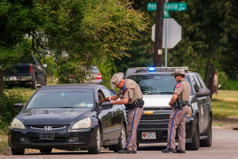 Texas DPS troopers make a traffic stop at Pennsylvania and Myrtle, near the intersection of...