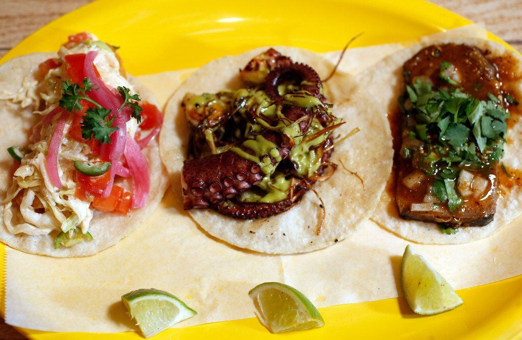 Revolver Taco Lounge's pulpo (octopus) taco, center, is featured at the beginning of the...