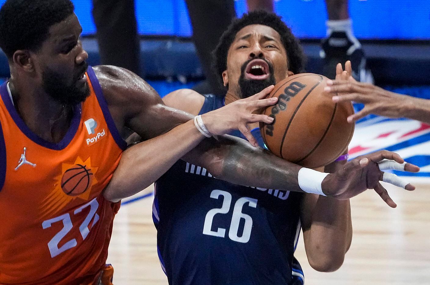 Dallas Mavericks guard Spencer Dinwiddie (26) is fouled by Phoenix Suns center Deandre Ayton...