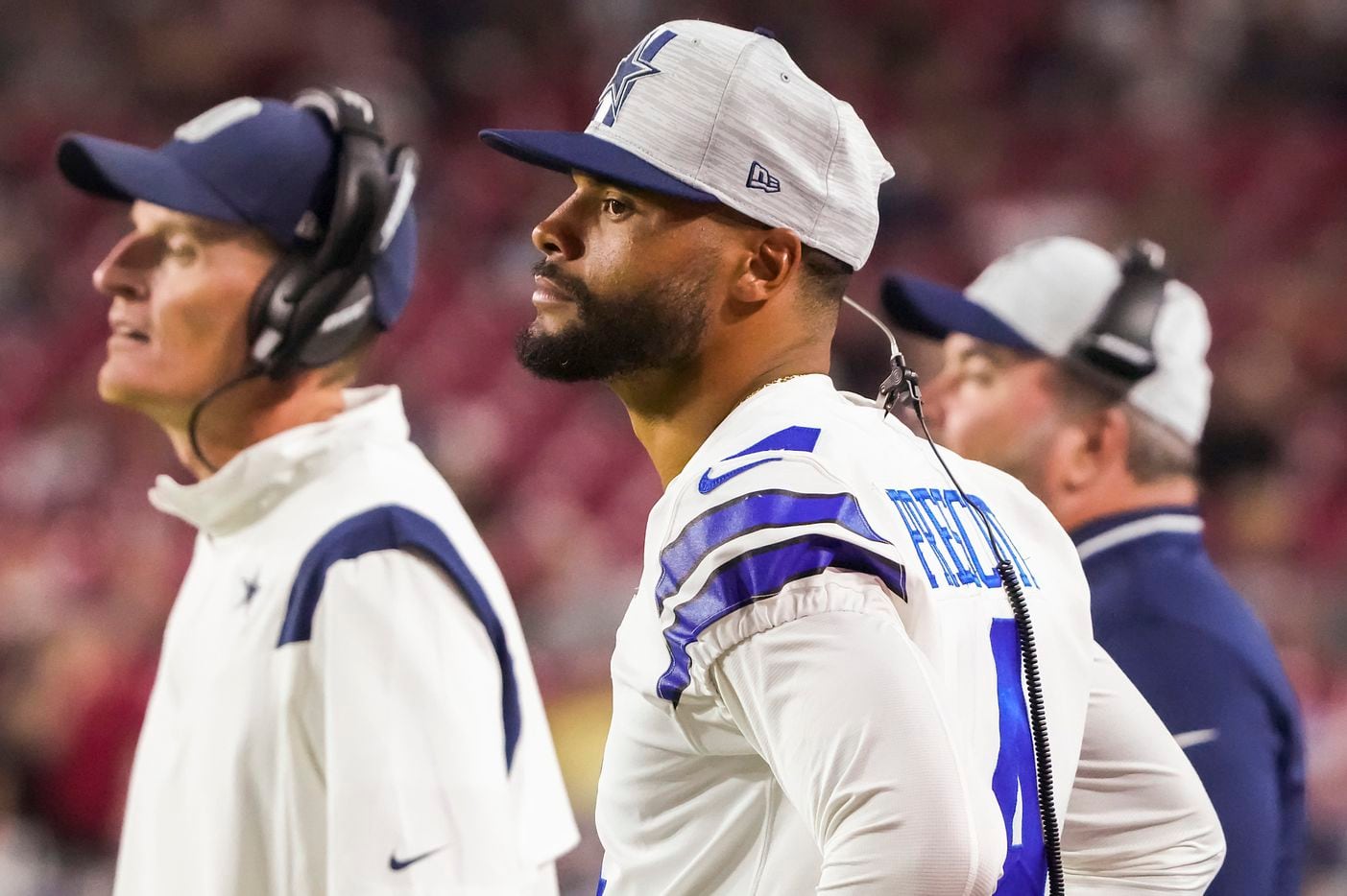 Dallas Cowboys quarterback Dak Prescott watches from the sidelines during the first quarter of an NFL football game against the Arizona Cardinals at State Farm Stadium on Friday, Aug. 13, 2021, in Glendale, Ariz.