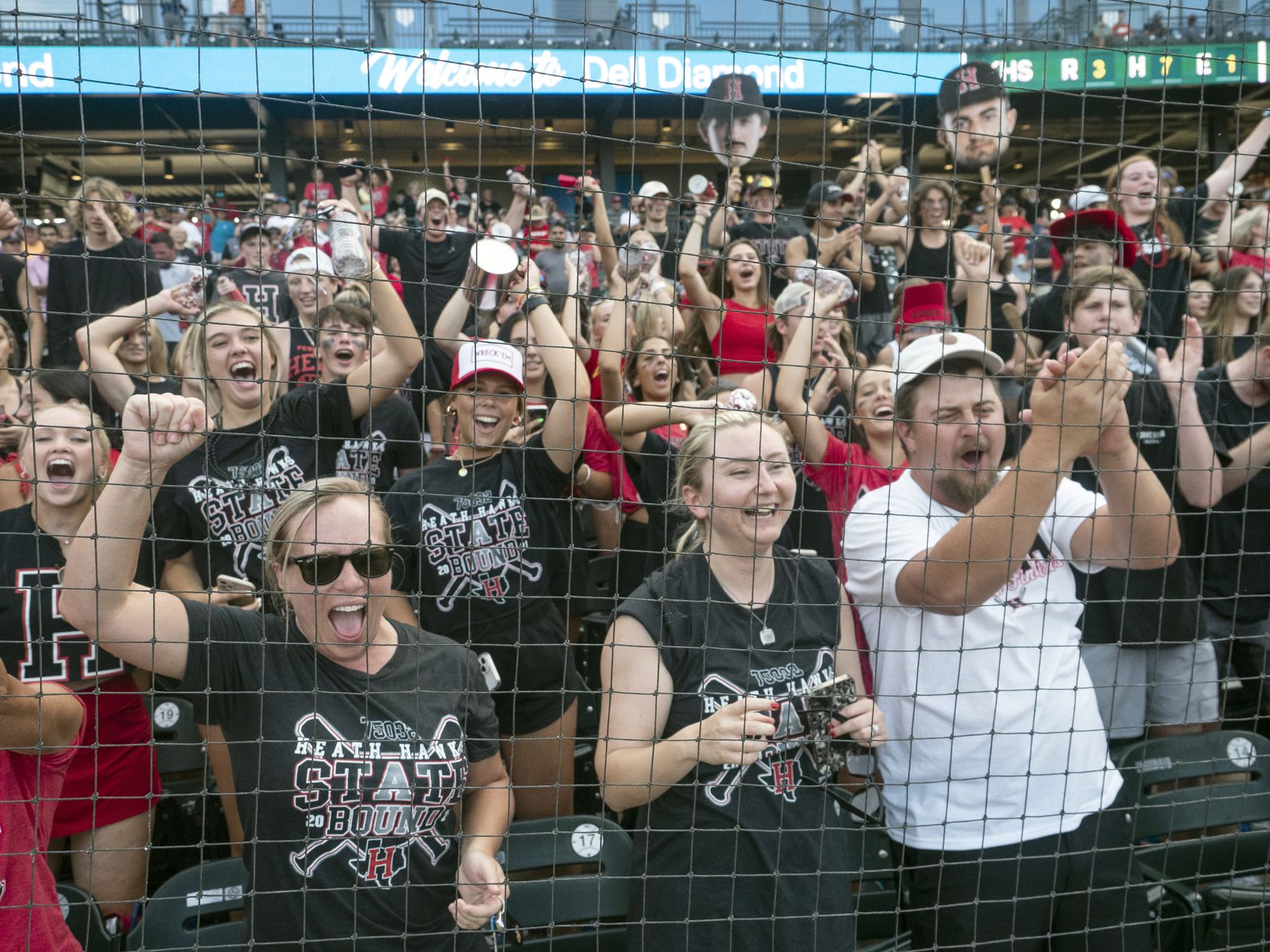 Rockwall-Heath fans celebrate the Hawks victory over the Keller Indians during the # inning...