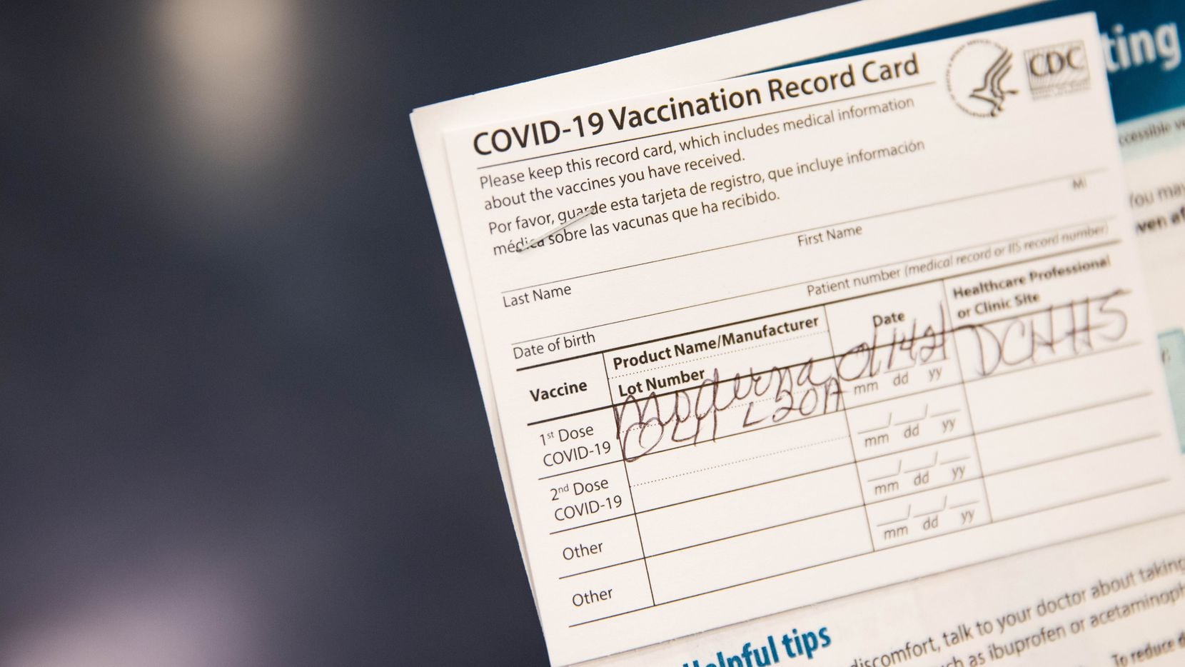Gladys Rodgers, 77, holds her COVID-19 vaccination card at Fair Park in Dallas on Thursday,...