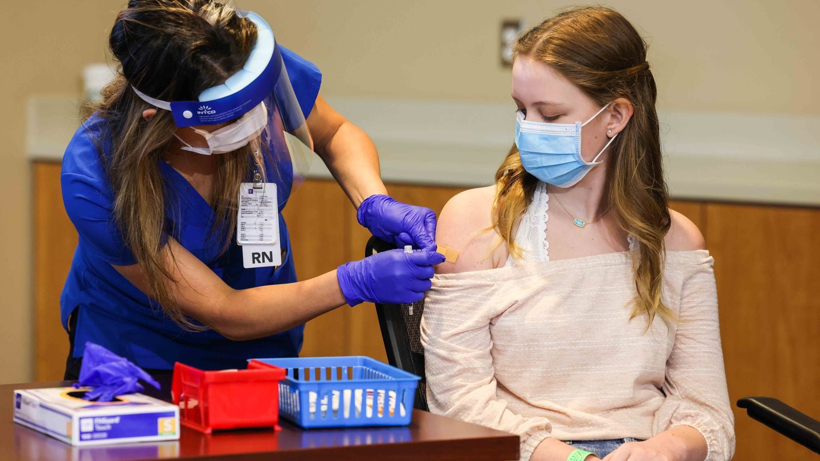 Madeleine Jenkins, 15, Dallas County Judge Clay Jenkins' daughter, received a COVID-19 vaccine as the first minor under 16 to get vaccinated in Dallas County at WISH Clinic Building at Parkland Memorial Hospital on May 13, 2021.
