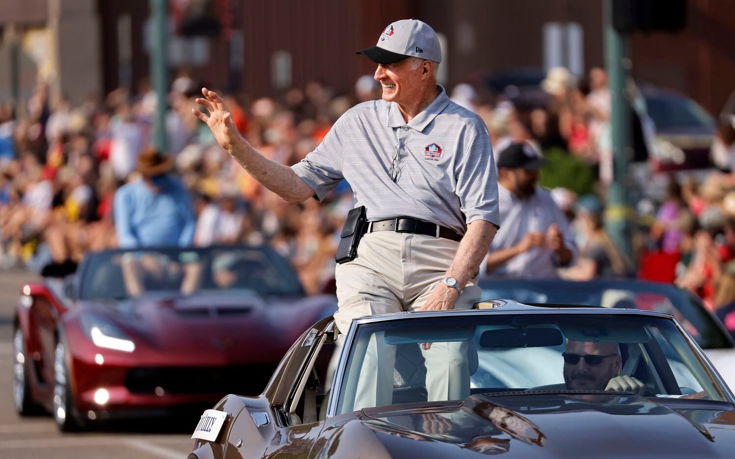 Dallas Cowboys Pro Football Hall of Fame member Bob Lilly waves to fans during the Canton Repository Grand Parade in downtown Canton, Ohio, Saturday, August 7, 2021. The parade honored newly elected and former members of the Hall, including newcomers and former Dallas Cowboys players Cliff Harris, Drew Pearson and head coach Jimmy Johnson. (Tom Fox/The Dallas Morning News)