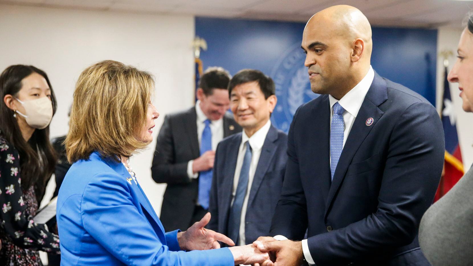 House Speaker Nancy Pelosi of Calif., shakes hand with  Rep. Colin Allred, D-Texas, right,...