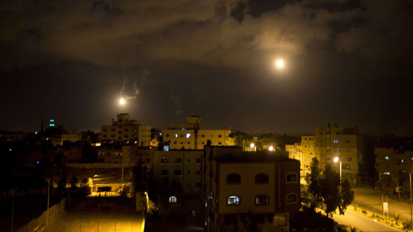 An Israeli army flare illuminating the sky above the Gaza strip on July 18, 2014. Israeli...