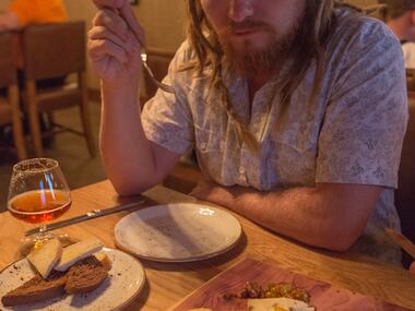 Local businessman Matt Arnold enjoys The Motherboard, a collection of chef favorite items...
