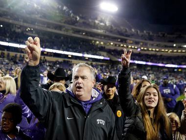 TCU Horned Frogs head coach Sonny Dykes celebrates the team's 62-14 win with family at Amon...
