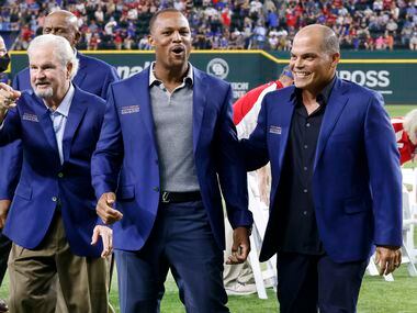 Former Texas Rangers third baseman Adrian Beltre (center) is congratulated by former Rangers...