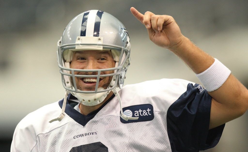 Quarterback Tony Romo (9) is all smiles during Dallas Cowboys training camp at Cowboys...
