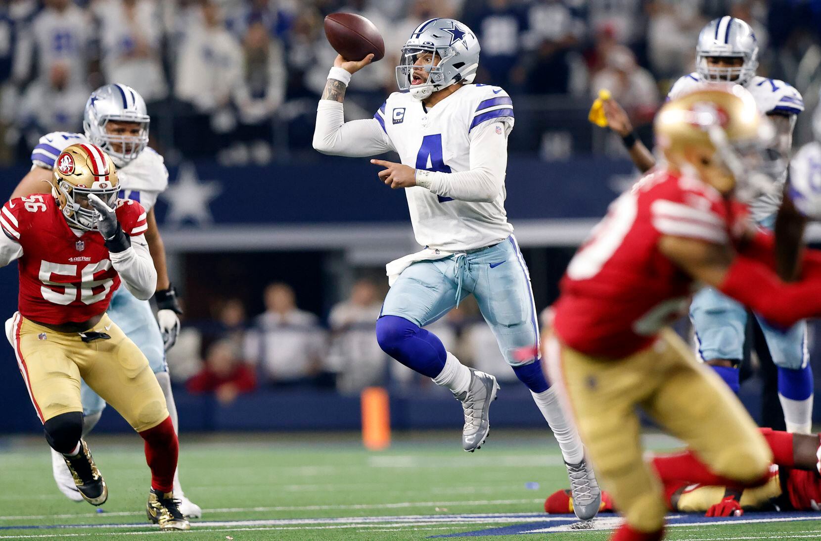 Dallas Cowboys quarterback Dak Prescott (4) tries to lob the ball to Ezekiel Elliott (not...
