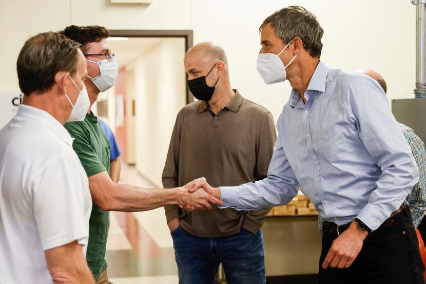 Beto O’Rourke shakes hands with a fourth year apprentice at North Texas Electrical Training...