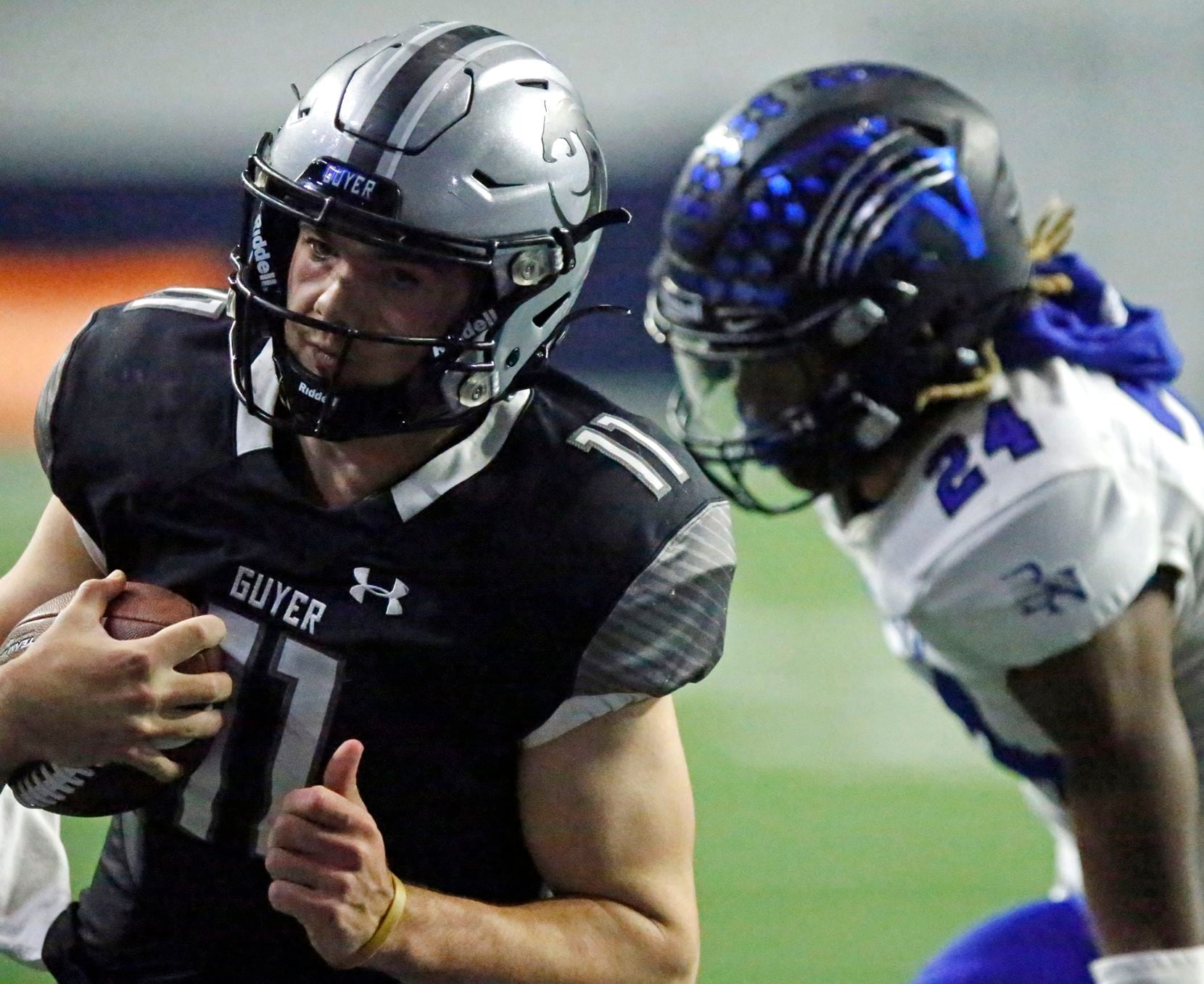 Guyer High School quarterback Jackson Arnold (11) outruns Byron Nelson High School defensive back Chauncey Mcgriff (24) for a touchdown during the first half as Denton Guyer High School played Trophy Club Byron Nelson High School in a Class 6A Division II Region I semifinal football game at The Ford Center in Frisco on Saturday, November 27, 2021. (Stewart F. House/Special Contributor)