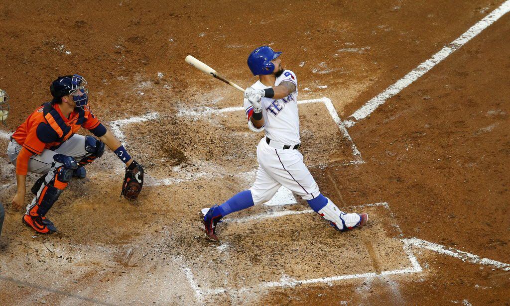 Texas Rangers second baseman Rougned Odor (12) smashes a two-run homer to the Home Run ...