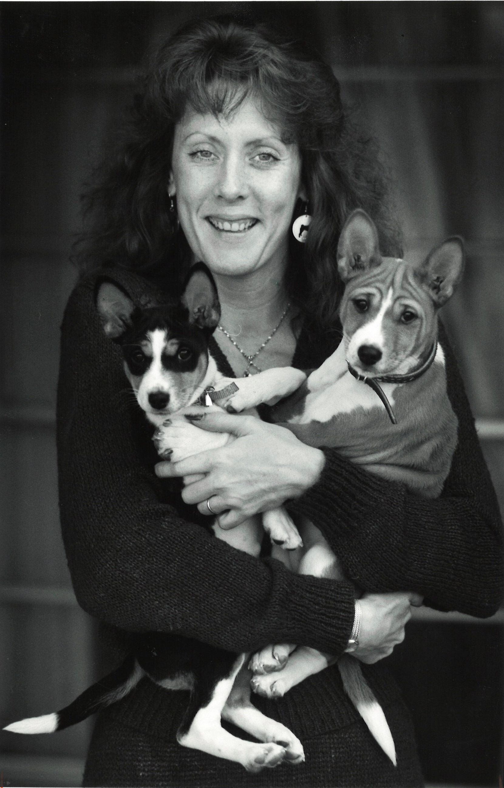 Kathy Brewer holds two Basenji pups in 1989.