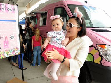 Seven-month-old Texana and her mom Chanel Tennison are excited about their purchases at the...