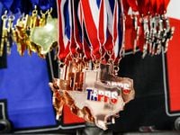 TAPPS swim meet medals during the TAPPS Division I state swim meet at the Mansfield ISD...