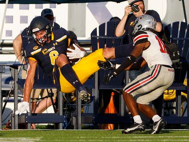 Highland Park wide receiver Luke Herring (6) falls into the end zone after catching a...