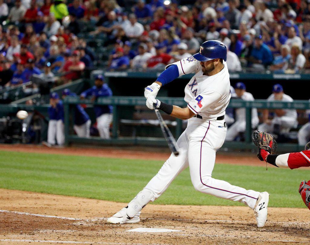 Texas Rangers' Joey Gallo hits a solo home run against the Los Angeles Angels during the...