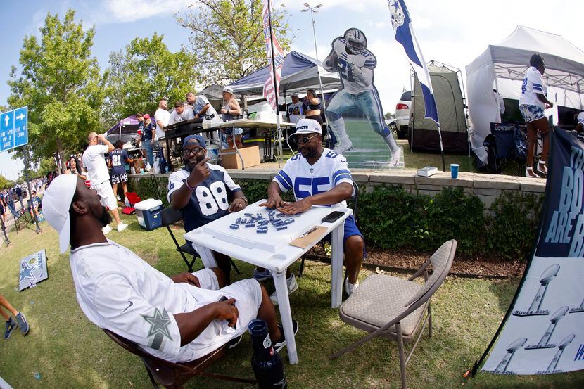 Fans tailgate outside AT&T Stadium before the Tampa Bay Buccaneers play the Dallas Cowboys...
