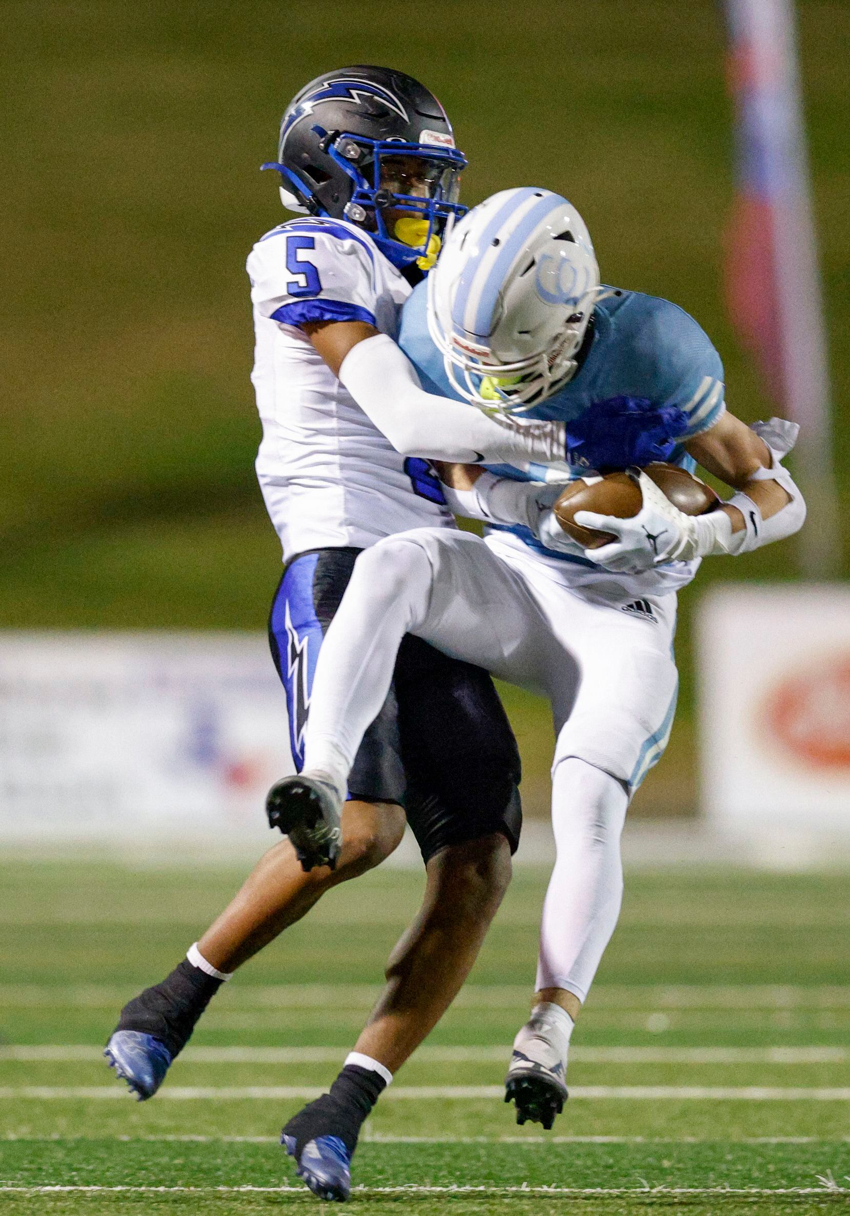 Dallas Christian wide receiver Zain Toliver (5) tackles Houston Cypress Christian wide...