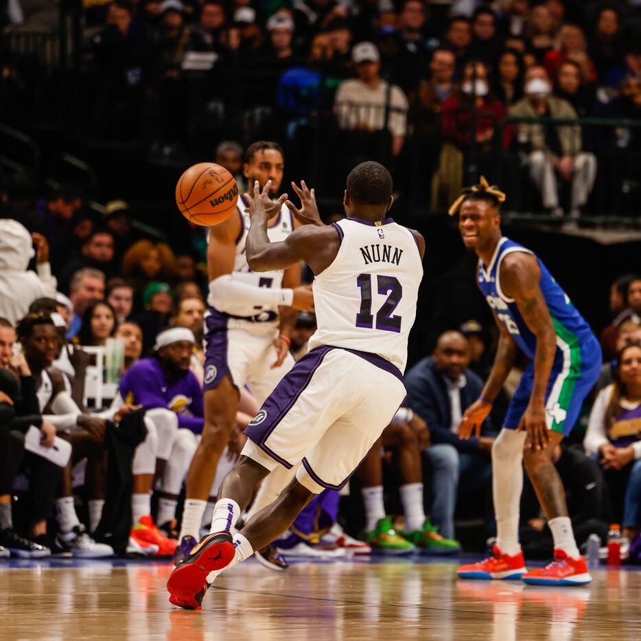 Los Angeles Lakers guard Kendrick Nunn (12) receives a pass from Los Angeles Lakers forward...