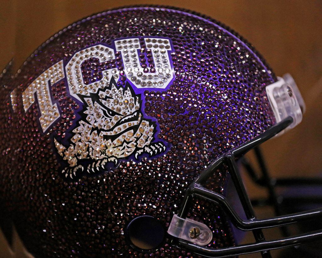 Numerous different football helmets sit on display in TCU head football coach Gary Patterson's home office/recruiting room at his residence in Fort Worth, Texas on Wednesday, July 5, 2018. (Louis DeLuca/The Dallas Morning News)