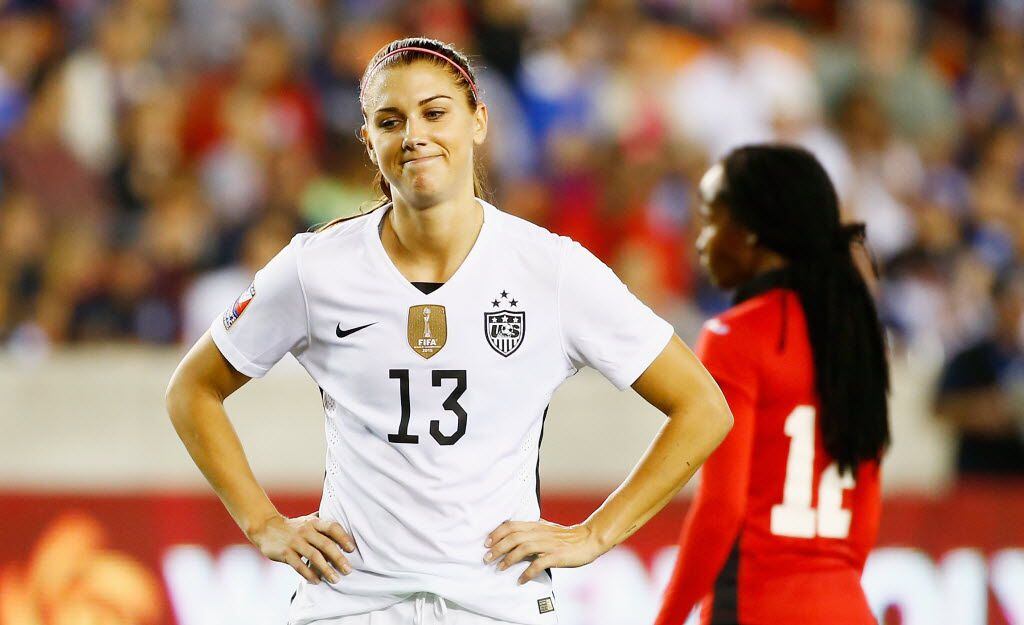 Alex Morgan #13 of the United States waits on the field in the second half of their game...