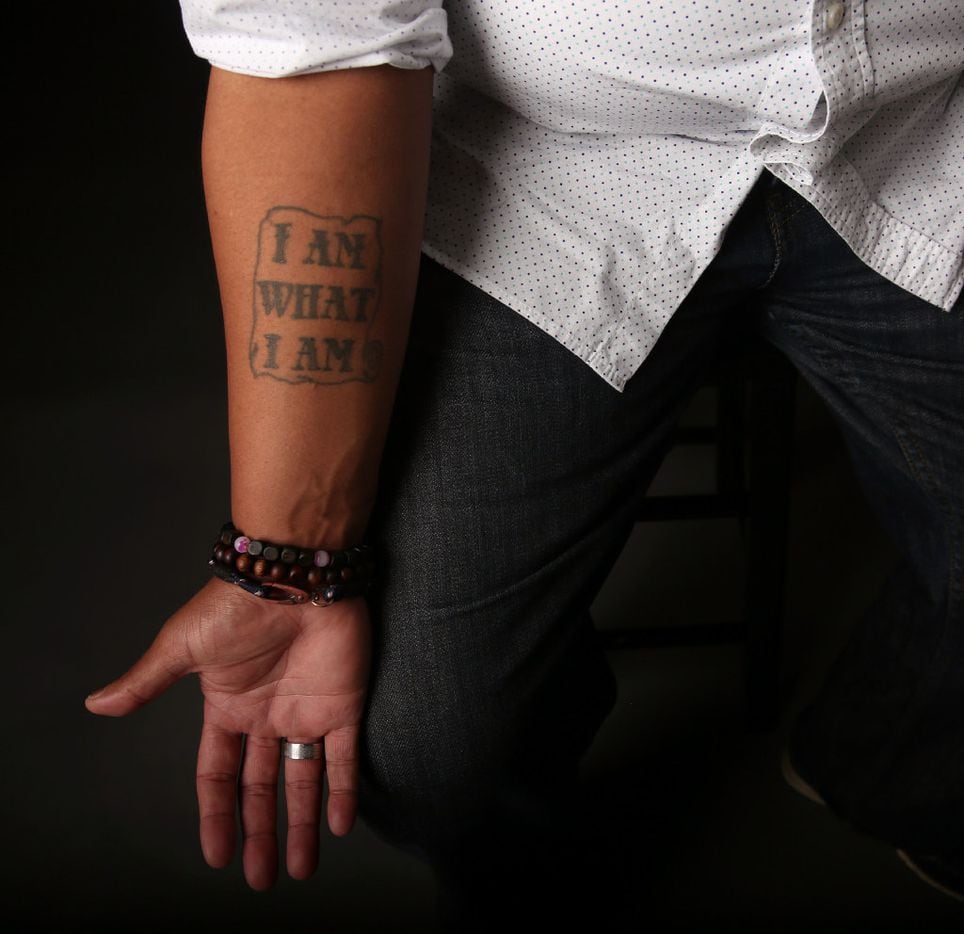 Trenton Johnson has a tattoo reading, "I am what I am." (Rose Baca/The Dallas Morning News)