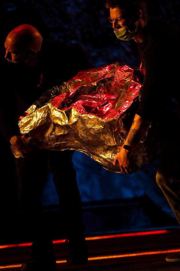 Supers bring in gold props during staging rehearsal for Dallas Opera’s Das Rheingold on...