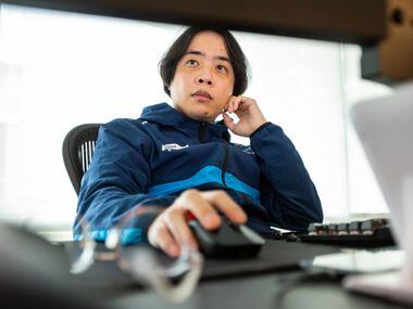 Dallas Fuel head coach Hee-Won "Rush" Yun studies game play on computer monitors during practice time at the Dallas Fuel headquarters in Dallas, on Monday, Sept. 13, 2021. 