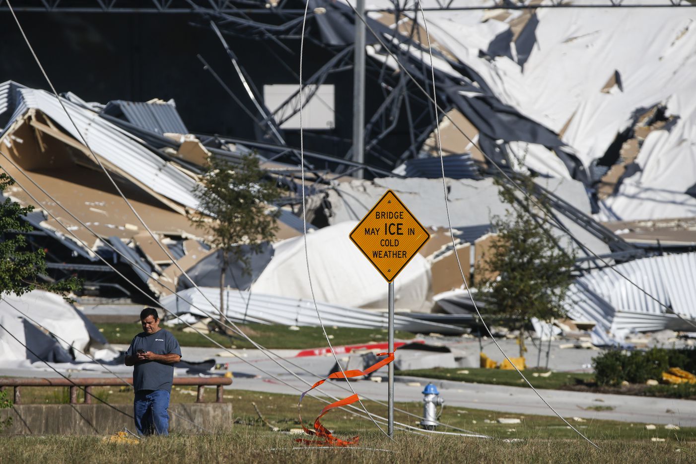 A collapsed building, damaged from a tornado the night before is seen near West Miller Road and South Shiloh Road in Garland, Texas, on Sunday, Oct. 21, 2019.