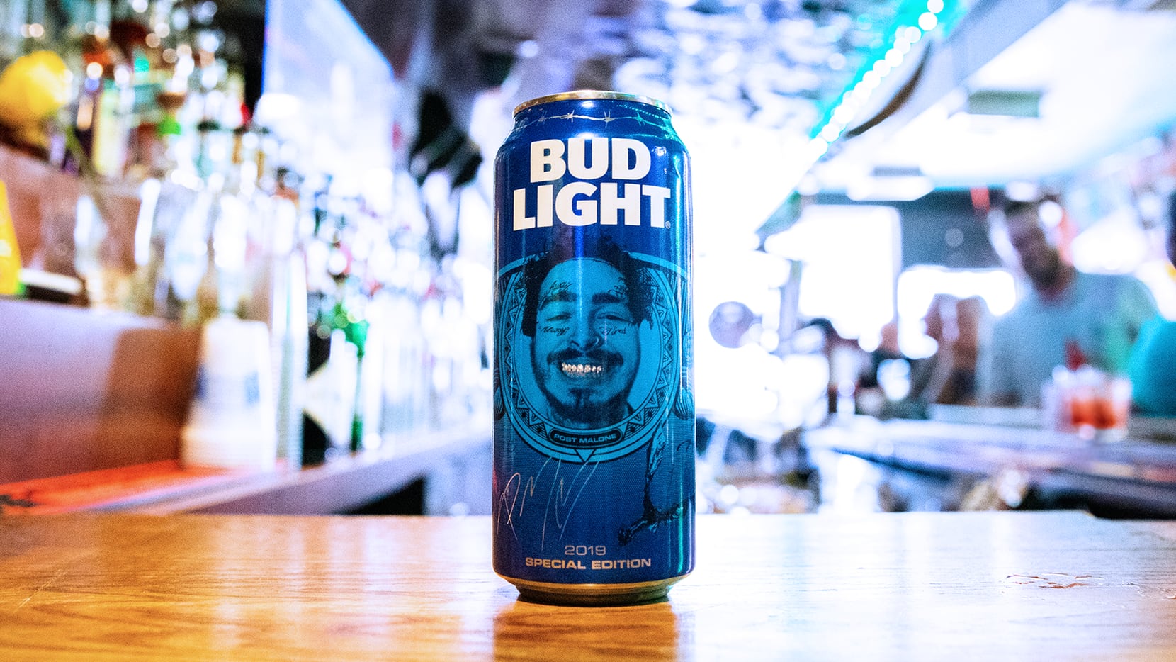 Post Malone's face is printed on Bud Light cans in 2019.