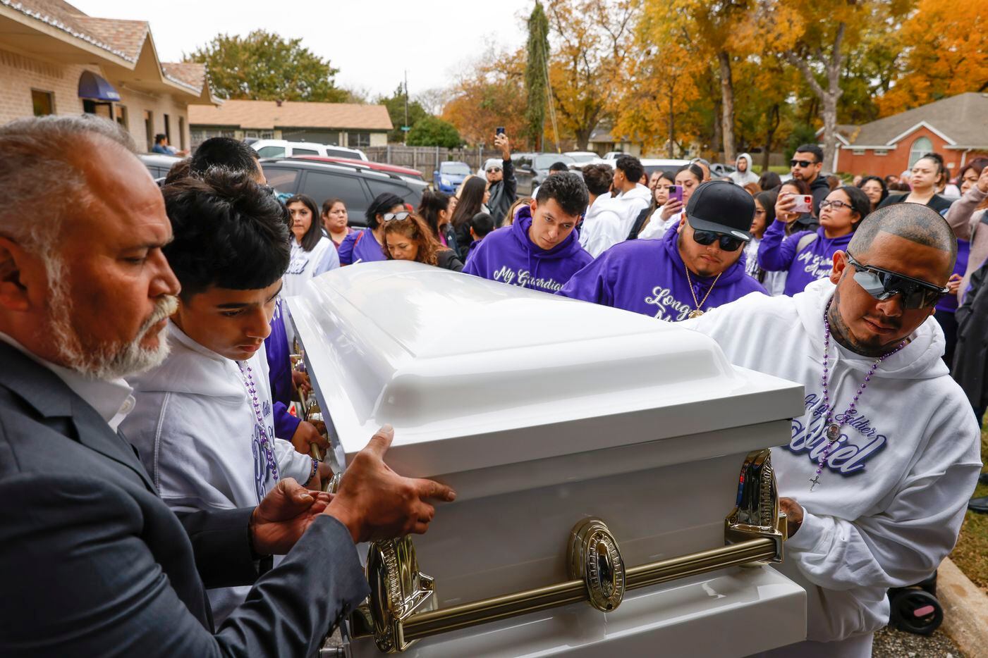 Family members of late Gabriel Zamora, 14, including his father Miguel, right, older brother...