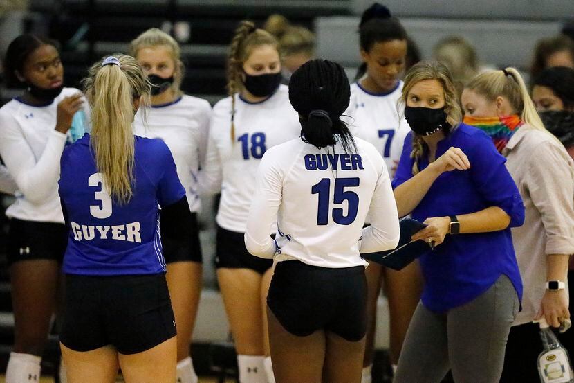 Denton Guyer coach Heather Van Noy gives her team instructions during a timeout in a match...