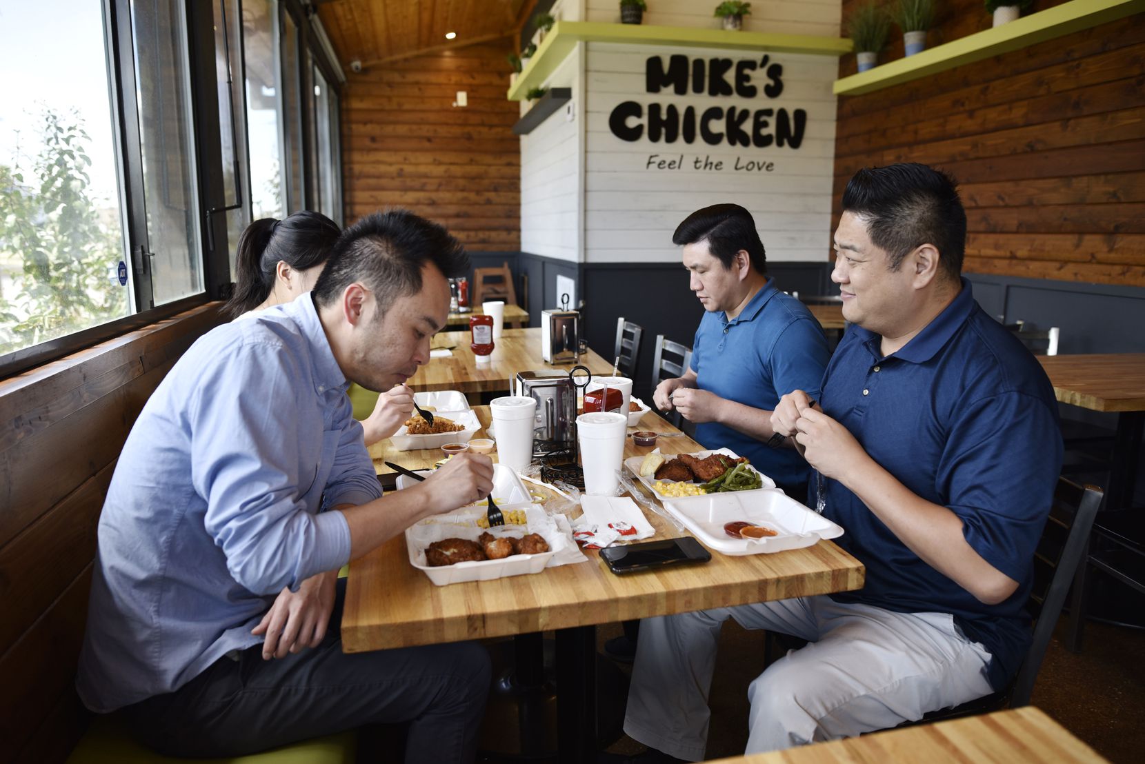 Clockwise: Jason Shau, left, Keith Cheng and David Tran, all from Los Angeles, have lunch at...