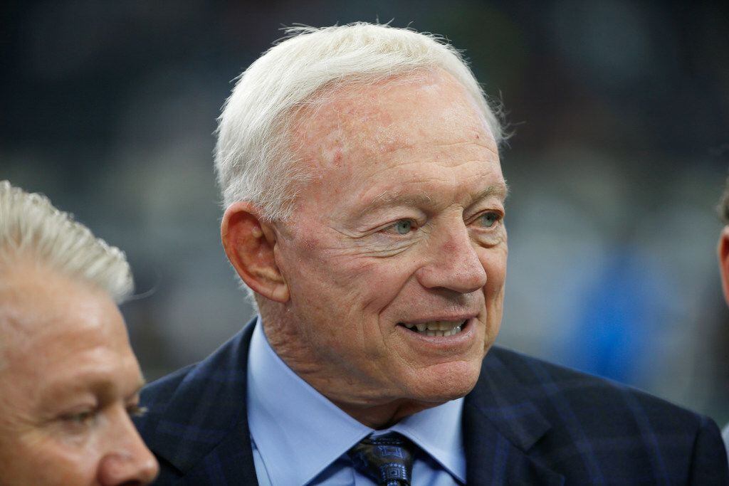 Dallas Cowboys owner Jerry Jones looks on from the sidelines before an NFL football game...