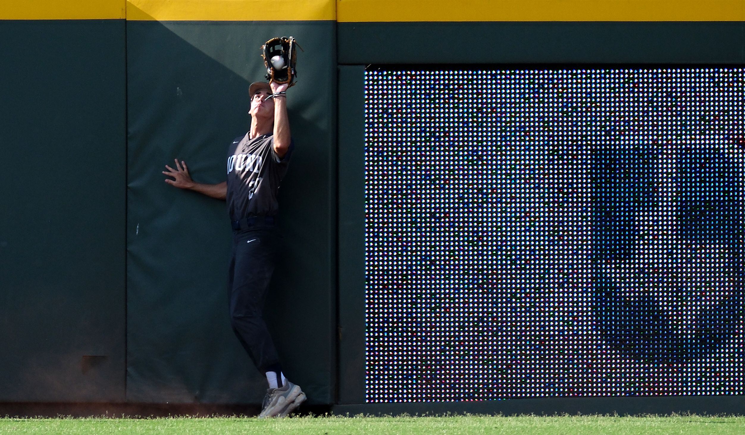 Flower Mound Andrew Robinson, (20), catches a sacrifice hit against the wall by Cypress...